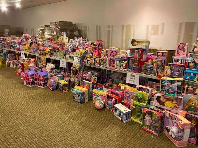 Table filled with presents for children of all ages 
